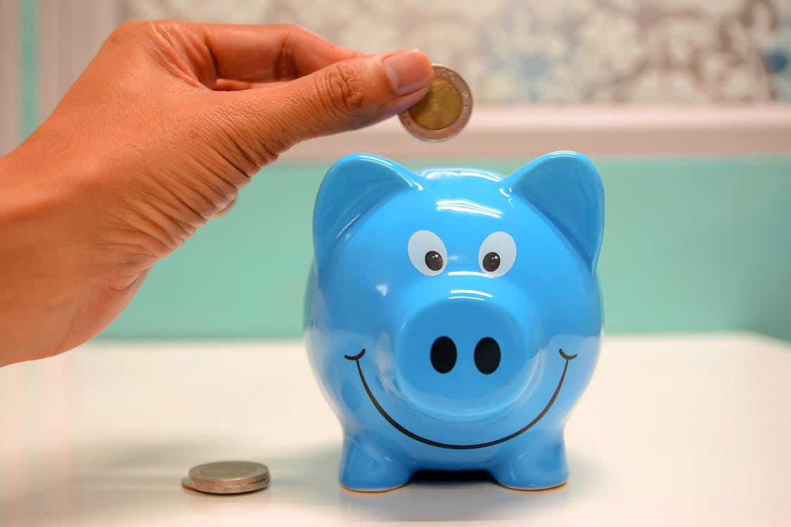 piggy bank to show effect of getting hit with tax evasion fines on companies